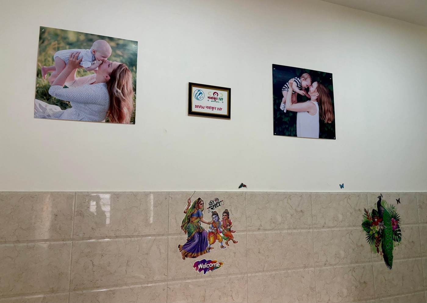 Wall of mother and baby photographs at Divoj Navankur IVF